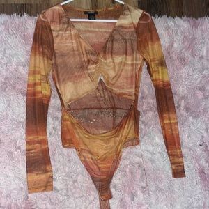 Red/orange bodysuit, long sleeve with cut out and chains